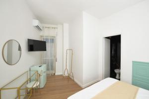 TV a/nebo společenská místnost v ubytování Mirosa Bed and Breakfast Luxury Rooms