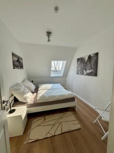 Postel nebo postele na pokoji v ubytování Seelöwe beim Ochsenturm am Deich