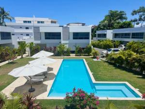 an image of a swimming pool in front of a building at Villa Hazel in Las Terrenas