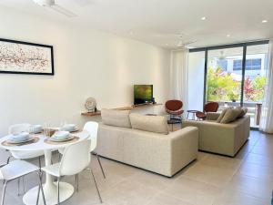 a living room with a couch and a table at Villa Hazel in Las Terrenas