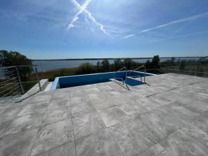 a swimming pool on the roof of a house at Sea and lake apartament in Mielno +20 photos