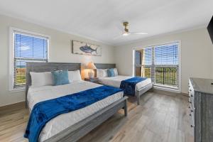 Ένα ή περισσότερα κρεβάτια σε δωμάτιο στο Premier Oceanfront Condo with Epic Island View +41 φωτογραφίες