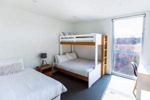 Ένα ή περισσότερα κρεβάτια σε δωμάτιο στο St Andrews Golf Course and Nature Getaway