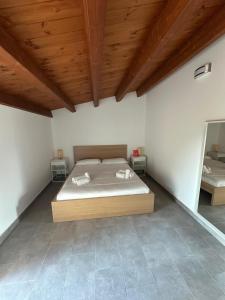 Postel nebo postele na pokoji v ubytování Casa nel verde a fontane bianche