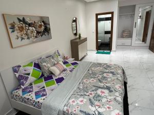 Ένα ή περισσότερα κρεβάτια σε δωμάτιο στο LUXES Appartement