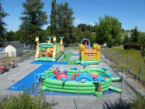 a playground with a water slide in a park at Longère spacieuse avec jardin à Saint-Evroult, animaux admis sur demande - FR-1-497-257 in Touquettes