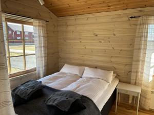 Postel nebo postele na pokoji v ubytování Piilopirtin Lomamökit + 12 fotografií