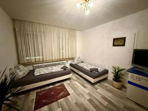 TV a/nebo společenská místnost v ubytování Pott Rooms & Flats