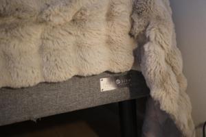 a stuffed animal sitting on top of a couch at Arctic Aurora Suite Rovaniemi in Rovaniemi