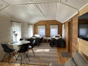 TV a/nebo společenská místnost v ubytování Piilopirtin Lomamökit