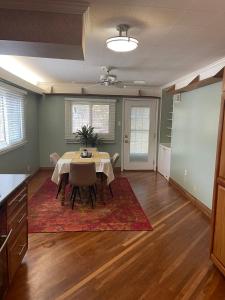 a dining room with a table and chairs in it at Splendid Room in House 10 mins to Airport in Saint Louis