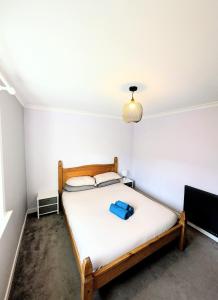 En eller flere senge i et værelse på Family Friendly Home in Fort William