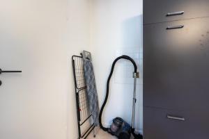 a room with a hose attached to a wall at Ferienwohnungen am Gellershagenpark 2 in Braksiek +21 photos