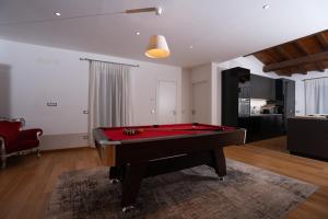 a living room with a pool table in it at Villa FARFA in Castelnuovo di Farfa