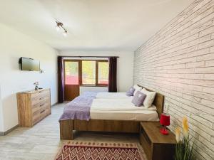 Postel nebo postele na pokoji v ubytování Panoramic Apuseni Doda Pilii + 85 fotografií