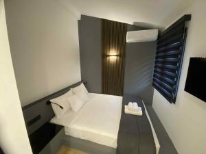 En eller flere senge i et værelse på Casa Olymbra