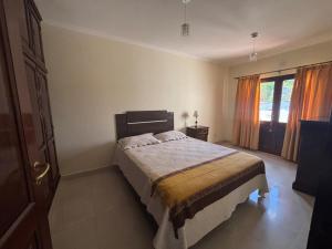 En eller flere senge i et værelse på Yunga Sanlorenceña