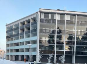 an office building with a lot of windows at Arctic Aurora Suite Rovaniemi in Rovaniemi
