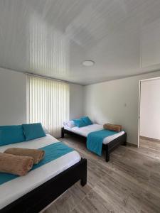 Voodi või voodid majutusasutuse Finca Chalet La Milagrosa toas +6 fotot