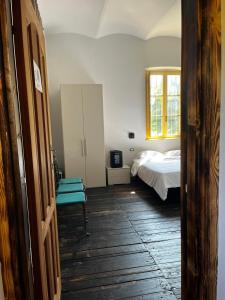 a bedroom with a bed and a window at La Locanda della Mandria 2 in Venaria Reale