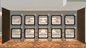 a double decker bus with twelve windows with mattresses at Cápsula Hotel in Florianópolis