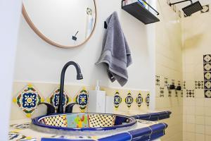 a bathroom with a sink and a mirror at Depas WAICURA'S in Loreto +74 photos