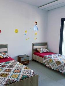 Ένα ή περισσότερα κρεβάτια σε δωμάτιο στο Appartement Prestige