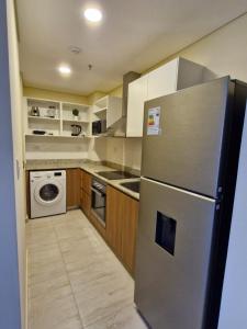 Kuchyň nebo kuchyňský kout v ubytování Edificio Ágora Villamorra Ensueño + 3 fotografie