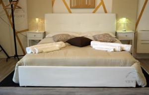 Postel nebo postele na pokoji v ubytování The View Loft