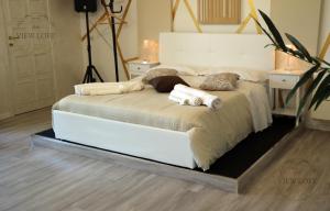 Postel nebo postele na pokoji v ubytování The View Loft