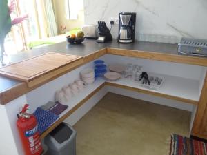 a kitchen counter with a drawer in the middle at Fler Payanke Apartment in Anse Royale