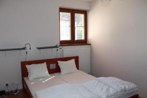 Posteľ alebo postele v izbe v ubytovaní Apartmány Olympia