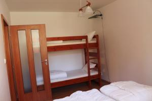 Posteľ alebo postele v izbe v ubytovaní Apartmány Olympia