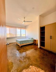 Ένα ή περισσότερα κρεβάτια σε δωμάτιο στο Casa Tepoztli