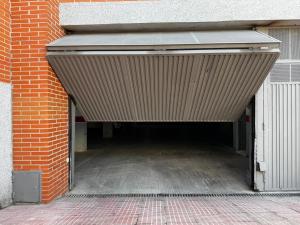an empty parking garage with a brown awning at Cozy Apartment Madrid in Madrid
