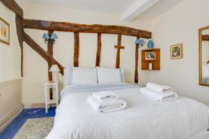 Voodi või voodid majutusasutuse Clematis Cottage toas