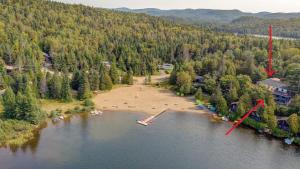 an aerial view of an island in a lake at La Passion #204 - Loft with private balcony and view in Sainte-Lucie-de-Doncaster