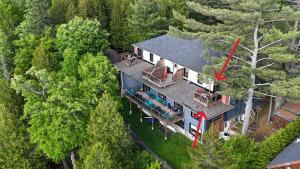 an aerial view of a house in the woods at La Passion #204 - Loft with private balcony and view in Sainte-Lucie-de-Doncaster