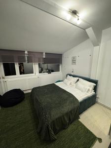 a bedroom with a large bed in a room at Bucharest Residence in Bucharest