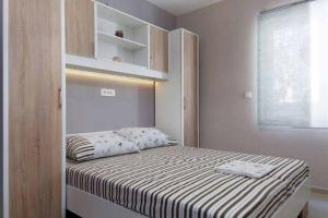 Postel nebo postele na pokoji v ubytování Apartments Romantica
