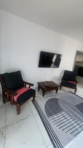 Μια τηλεόραση ή/και κέντρο ψυχαγωγίας στο Departamento con bajada al lago