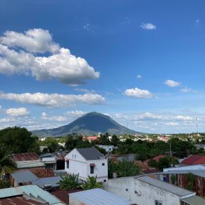 a view of a mountain from a city at Hoàng Anh Hotel in Ấp Bàu Sen