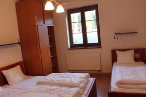 Posteľ alebo postele v izbe v ubytovaní Apartmány Olympia