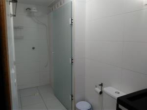 a bathroom with a shower and a toilet at Excelente Apto Próx. Centro Curitiba in Curitiba +15 photos