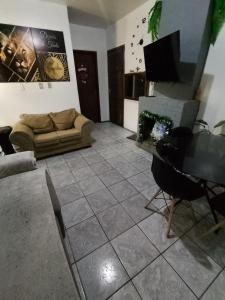 Posezení v ubytování Pousada Bibi dormitorio e cafe