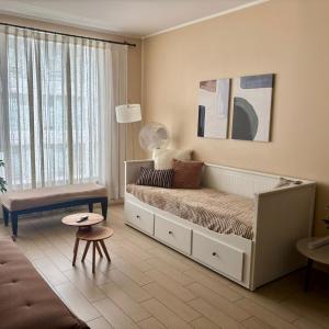 Un pat sau paturi într-o cameră la Excelente departamento en Las Condes