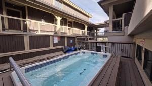 a swimming pool on a balcony with a building at Romance at Riverbends' Snowflake Lift in Breckenridge