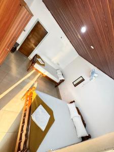 an overhead view of a bedroom with a bed at Rafters Retreat Coorg The Riverside Homestay in Srimangala