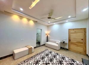 a living room with a couch and a rug at 1 - bedroom near Lyallpur galleria in Faisalabad