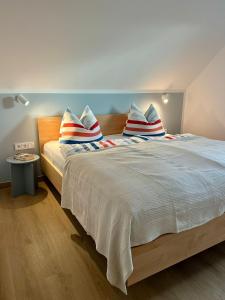 Ένα ή περισσότερα κρεβάτια σε δωμάτιο στο H24ZINGST - Das Ferienhaus